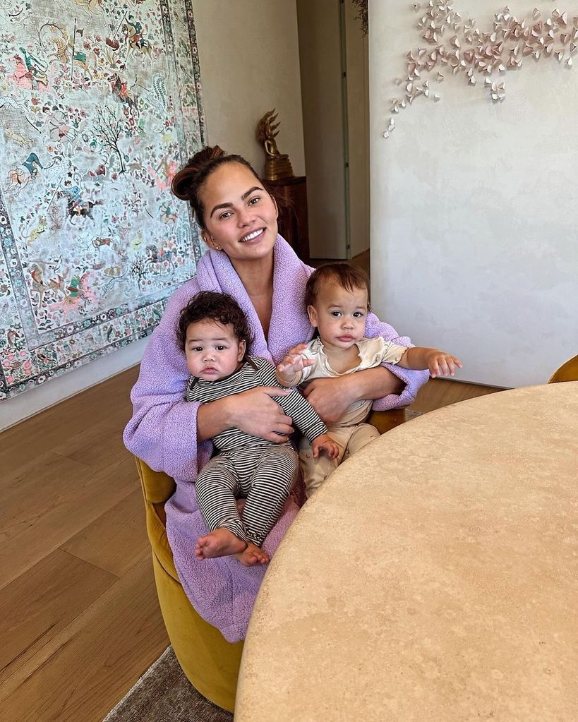 Chrissy Teigen cuddles up to babies Esti and Wren before Oscars after