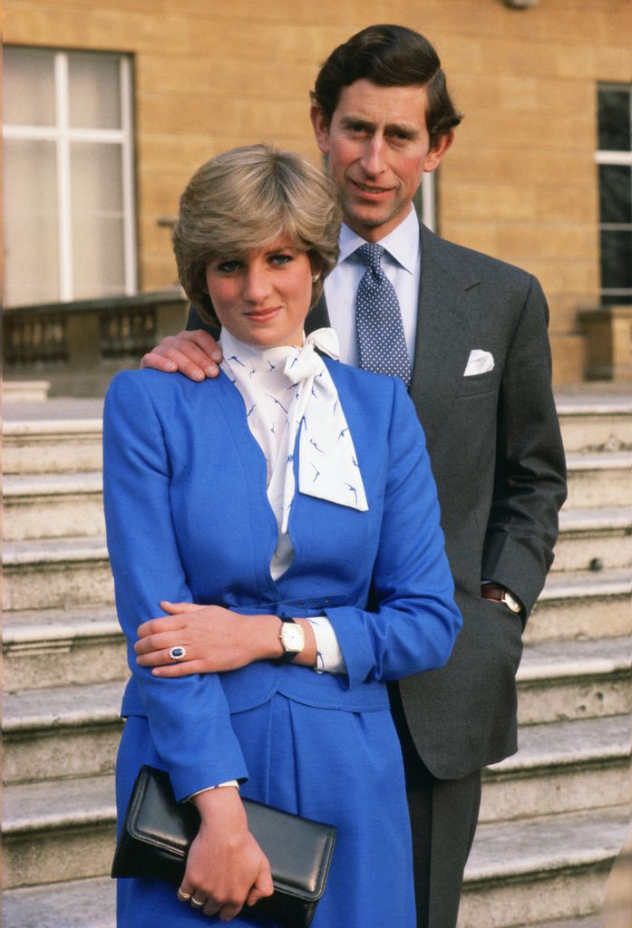 Princess Diana in blue and Prince Charles in a suit