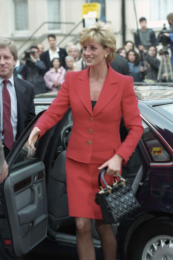  Princesse Diana teamed her red suit with her Lady Dior bag in 1996
