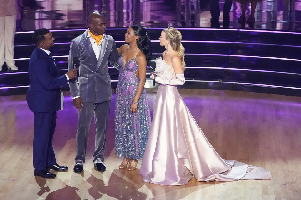 Adrian Peterson stands with Britt Stewart with the DWTS hosts 