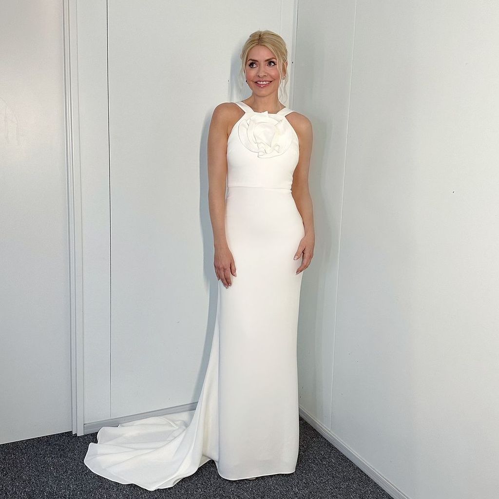 Holly Willoughby in a white halterneck dress with a train