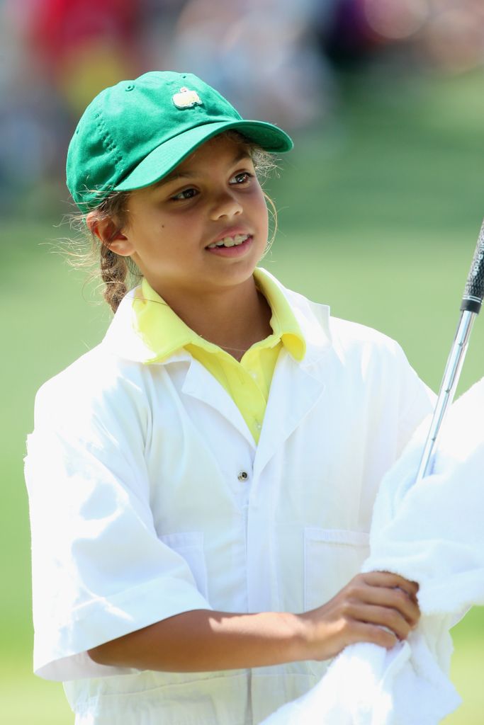 Sam Woods works as a caddie for her father Tiger Woods during the Par 3 Contest prior to the start of the 2015 Masters Tournament at Augusta National Golf Club on April 8, 2015 in Augusta, Georgia.