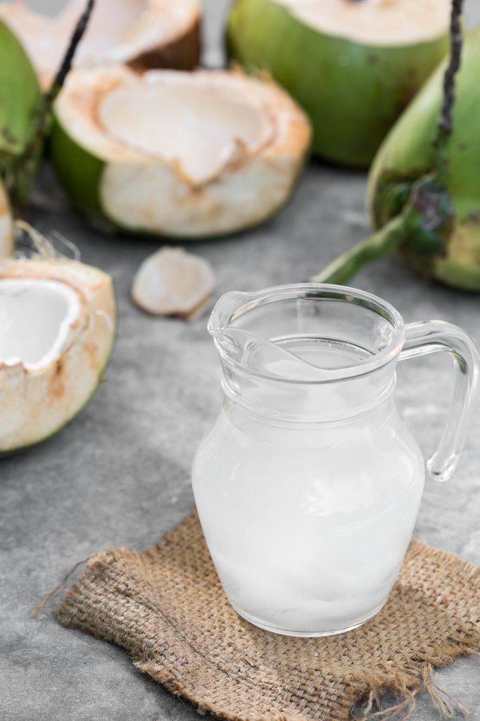 Coconut water in a glass pitcher