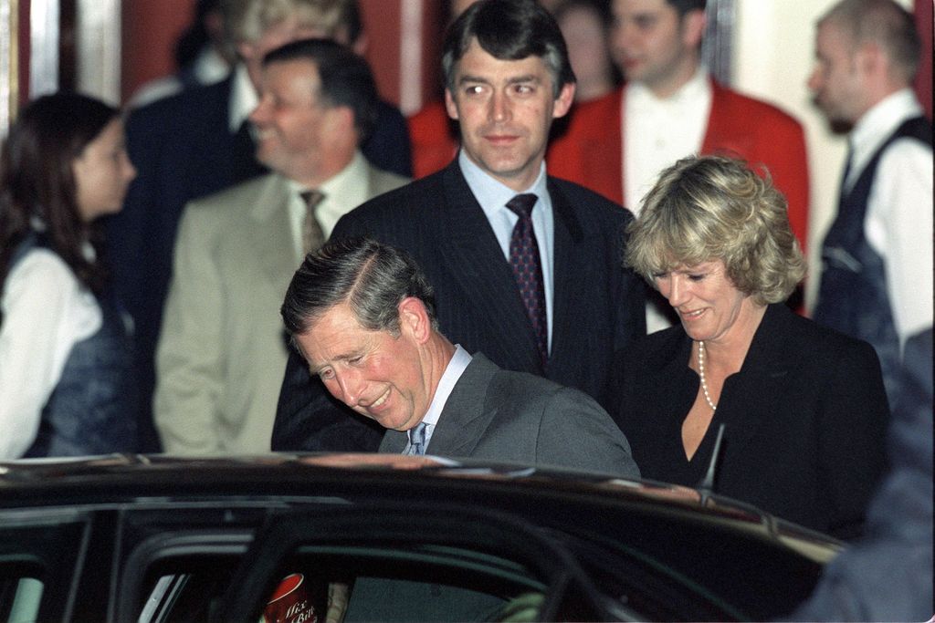 Prince Charles getting in a car with Camilla and his bodyguard Peter Brown