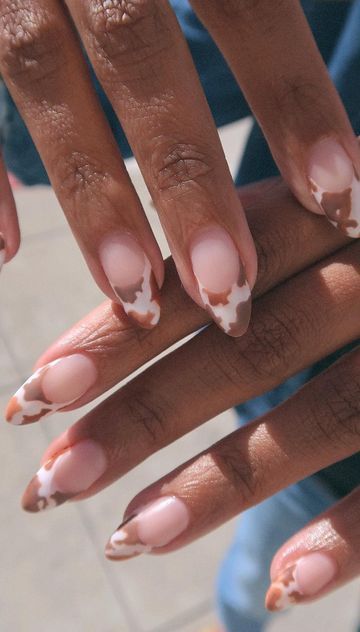 light brown cow print manicure nails