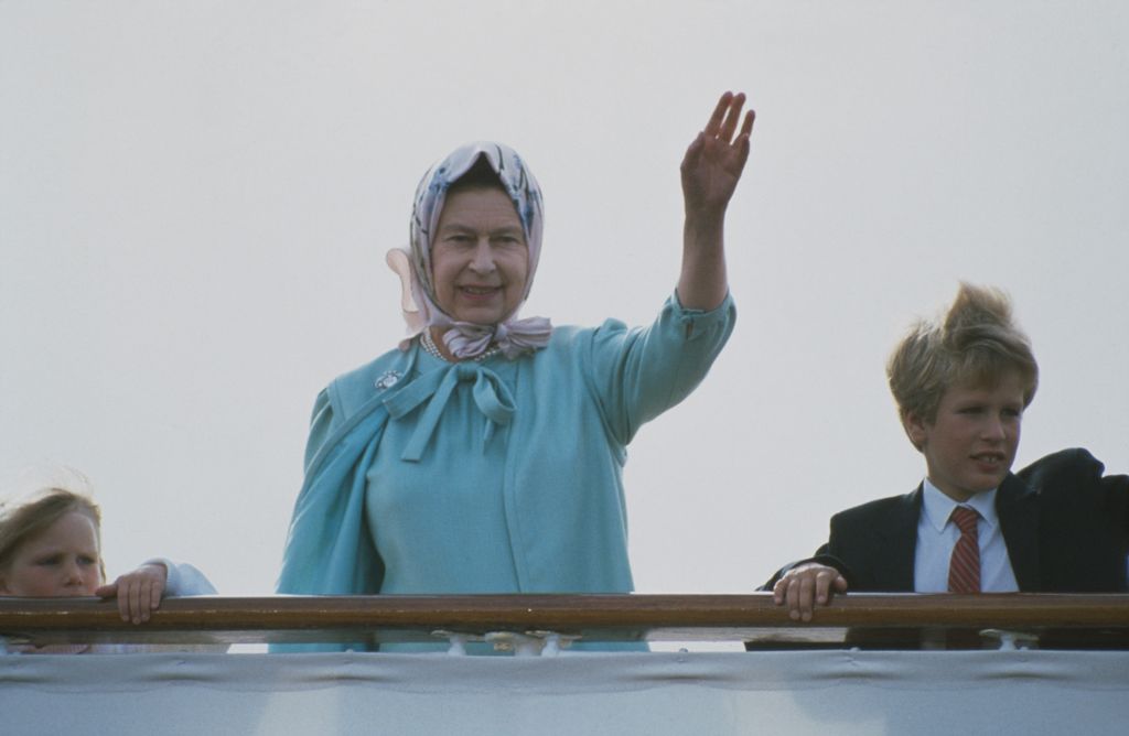 Queen Elizabeth II with her grandchildren Zara Phillips and Peter Phillips on board the Royal Yacht Britannia, 6th August 1986. (Photo by Tim Graham Photo Library via Getty Images)