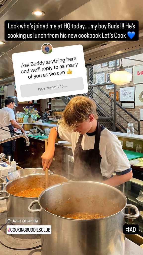 young boy stirring a big pot in the kitchen 