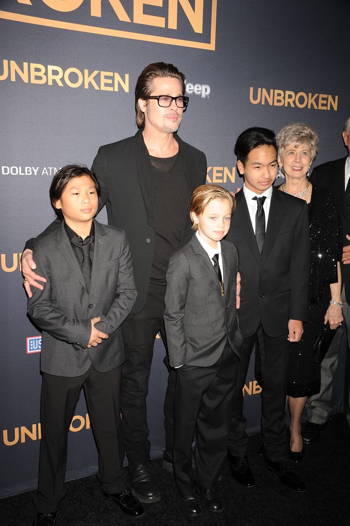 Brad Pitt posing with his children (from left) Pax Jolie-Pitt, Shiloh Jolie-Pitt, and Maddox Jolie-Pitt and his parents Jane Etta Pitt and William Alvin Pitt