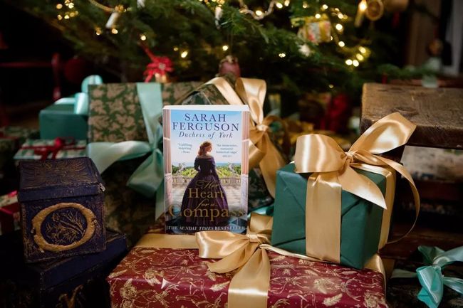 Sarah Fergusons novel underneath a Christmas Tree surrounded by presents
