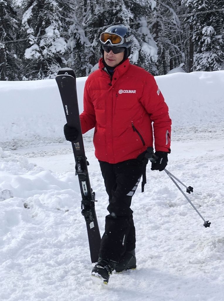 Prince Edward carrying skis in St Moritz