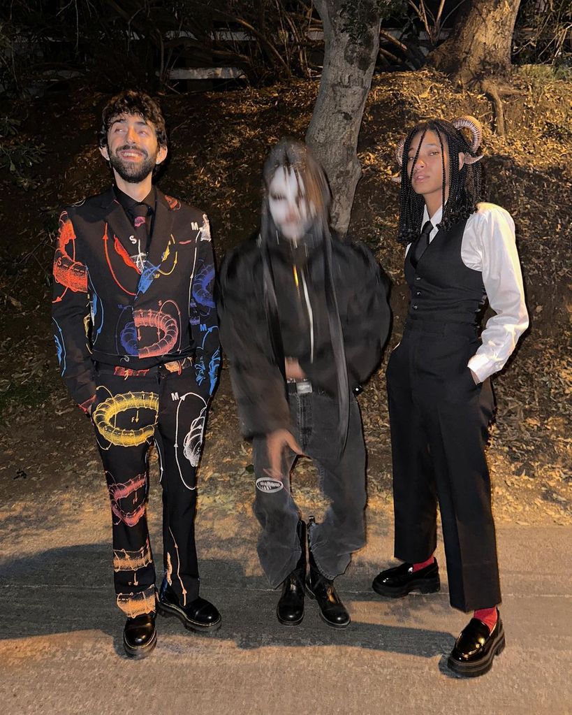 Jaden and Willow Smith pose with a friend at a Halloween party