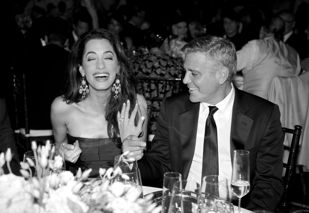 Amal and George dining in Italy