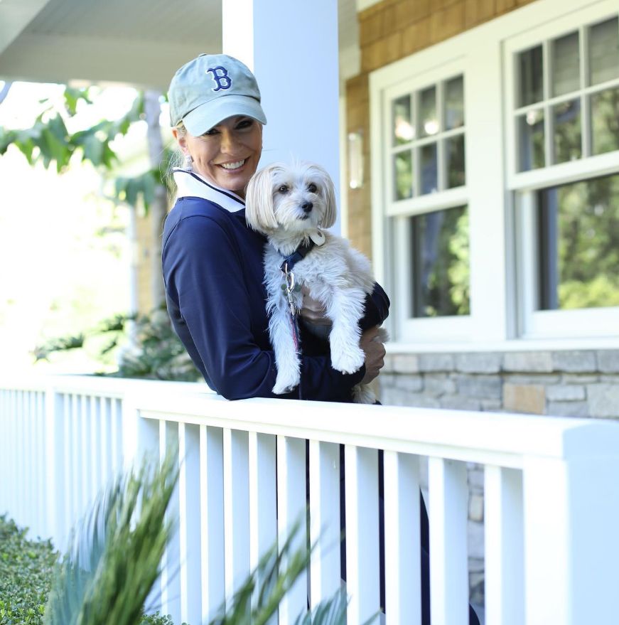 Jennifer Ashton holding a white dog
