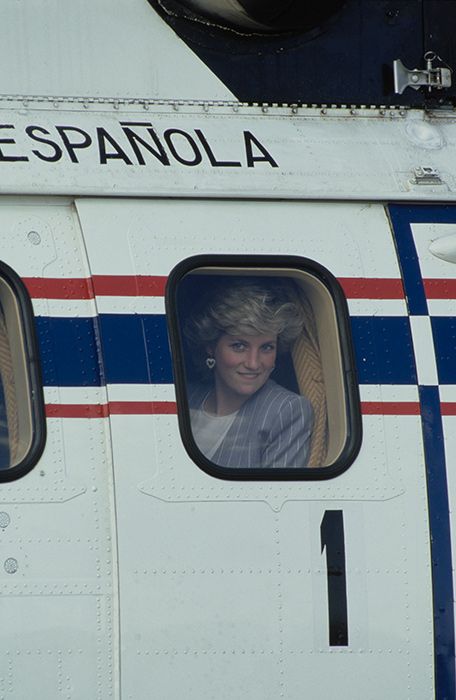 Princess Diana looks out of an airplane window after landing in Spain during Royal tour, Spain, 24th April 1987