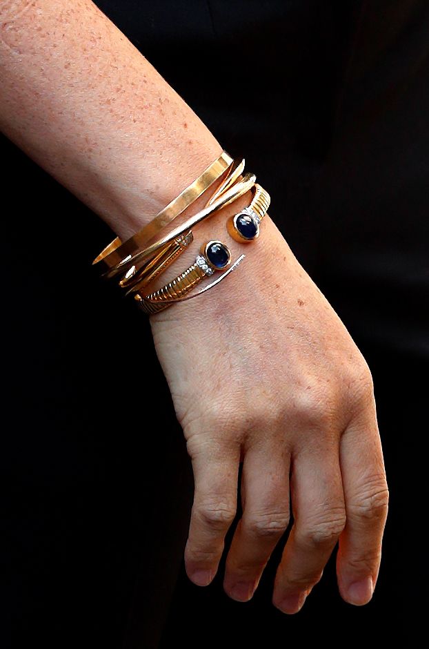 Meghan rarely takes off her Cartier bracelets