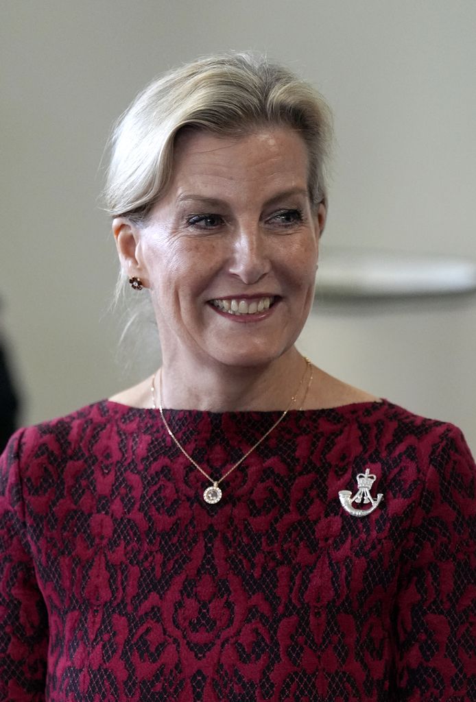 Sophie looked glamorous in a burgundy red dress