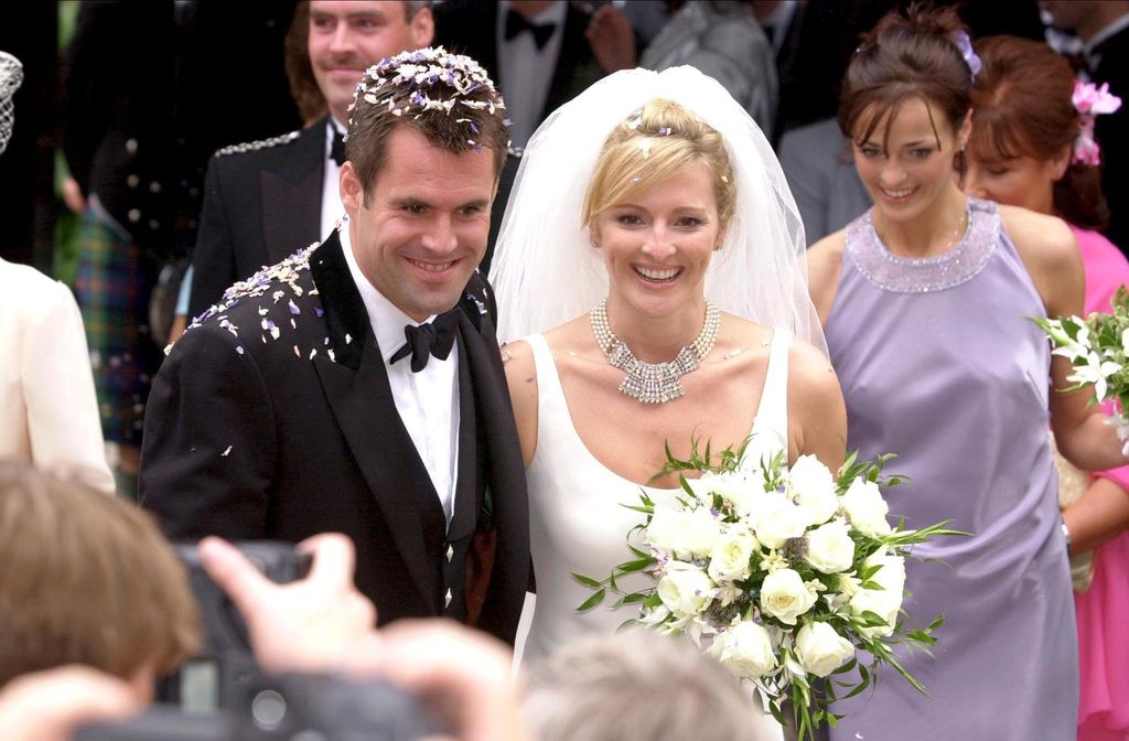 Gabby Logan and her husband covered in confetti on their wedding day