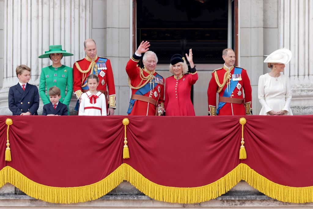 King Charles and Queen Camilla wave from the Buckingham Palace balcony at Trooping the Colour