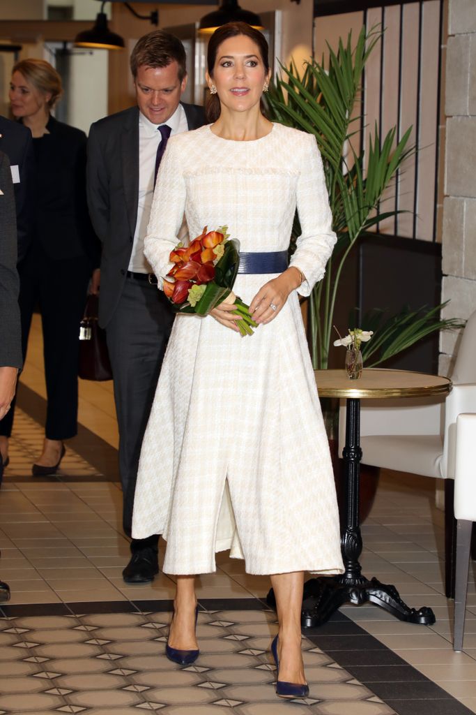 Crown Princess Mary of Denmark in a white dress and blue belt