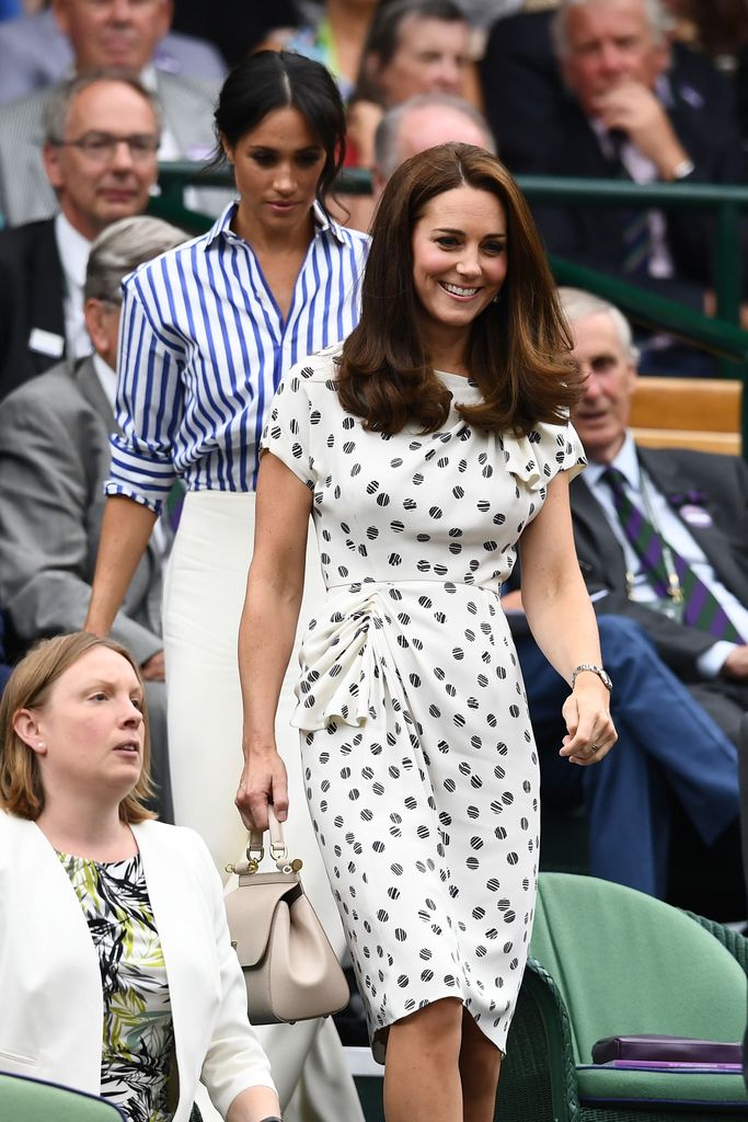 Meghan, Duchess of Sussex and Catherine, Duchess of Cambridge attend day twelve of the Wimbledon Lawn Tennis Championships