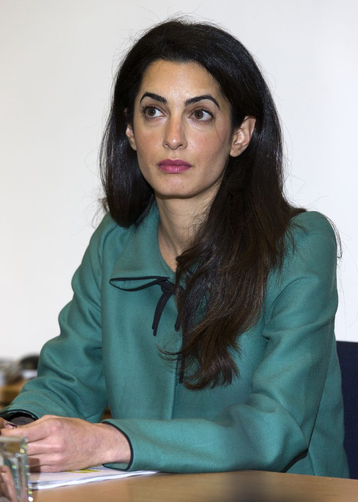 amal in 2012 wearing teal shirt