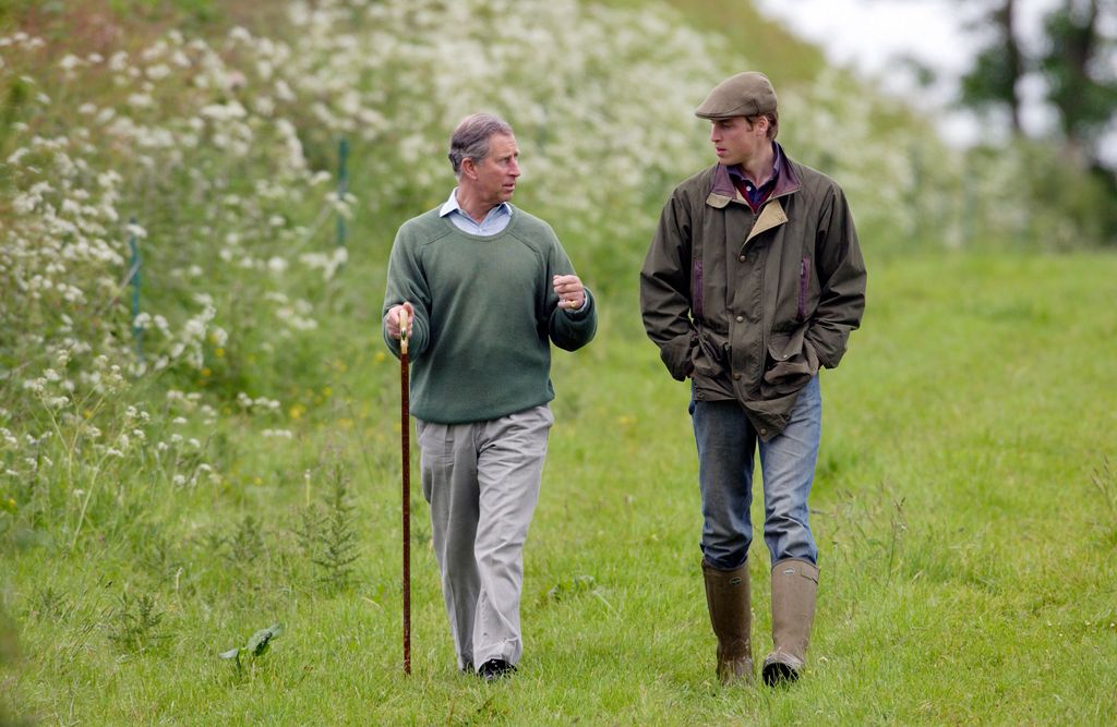 King Charles and Prince William walking in country clothes