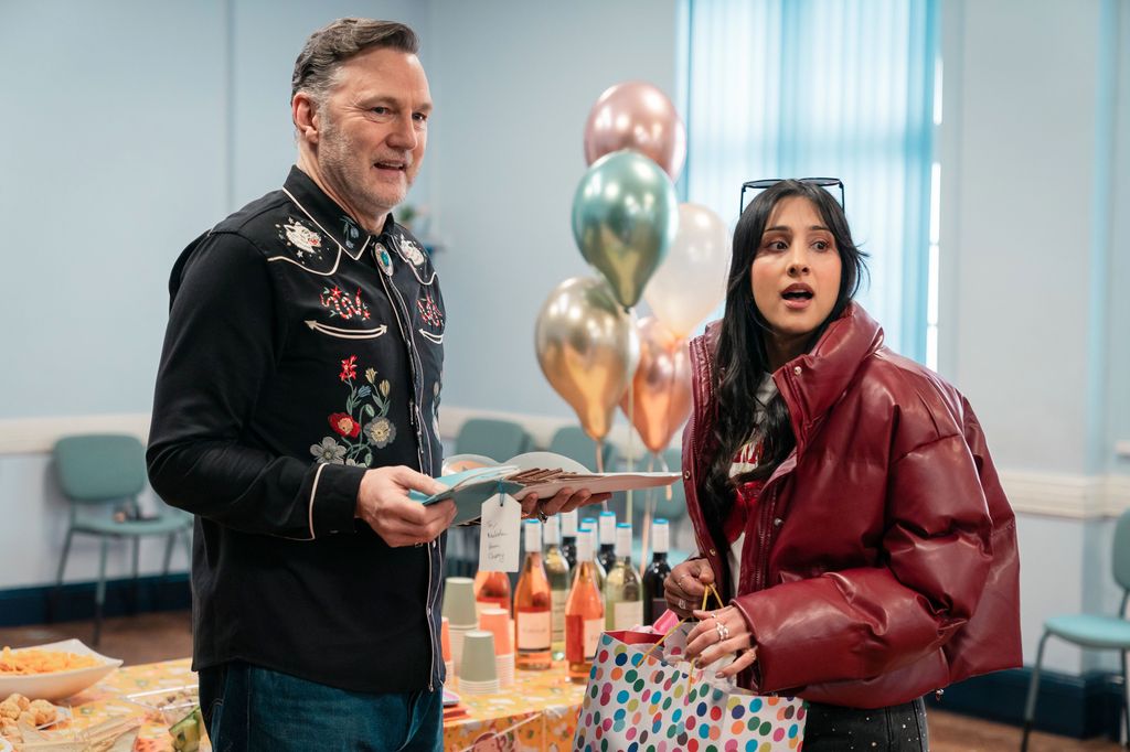 man and woman standing in room