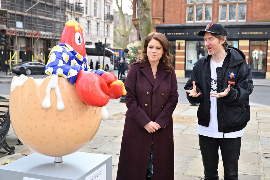 Eugenie with artist Philip Colbert and his creation