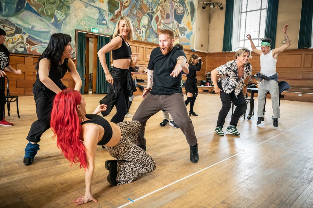 Dianne Buswell dances on the floor while Neil Jones gets his groove on during Strictly rehearsals