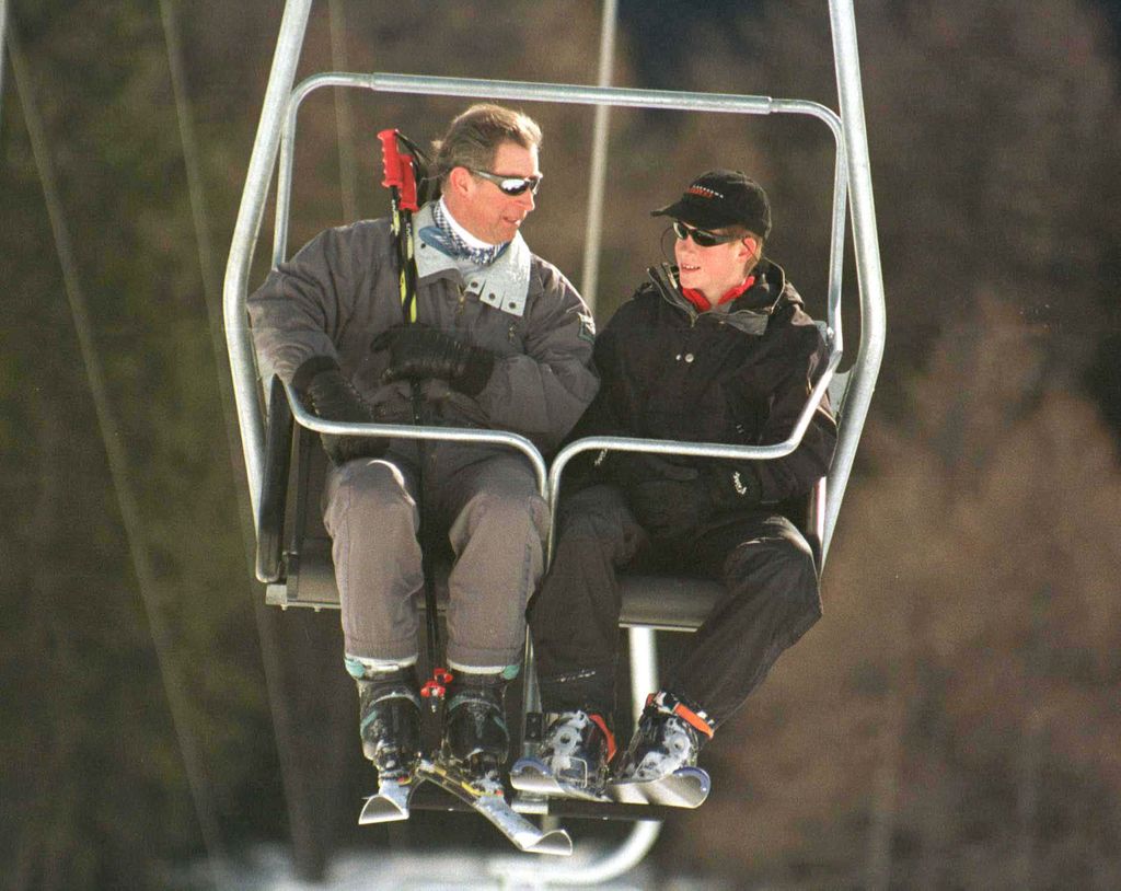 King Charles and Prince Harry take the ski lift at their skiing holiday to Klosters, Switzerland in 1999