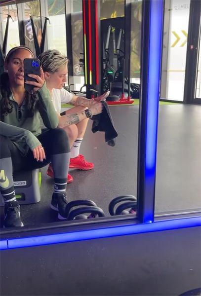 Alex Scott and friend at the gym