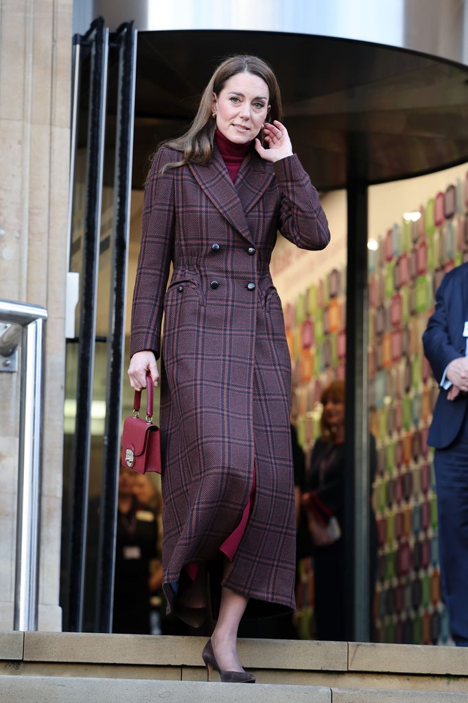 Kate Middleton carrying red bag leaving The Royal Marsden