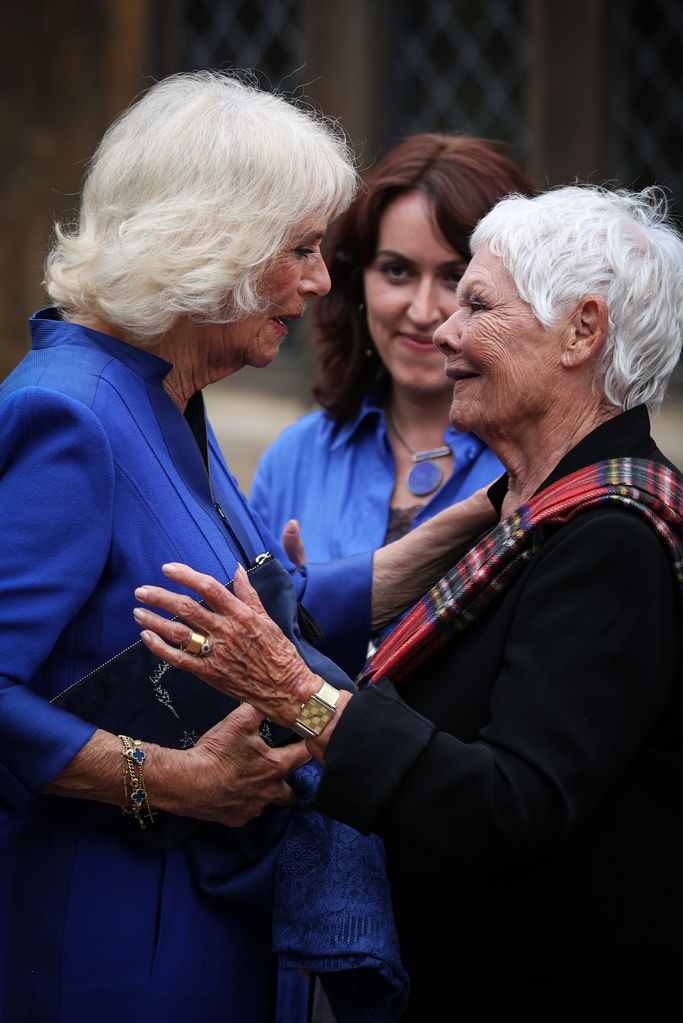 Queen Camilla warmly greets Dame Judi Dench 