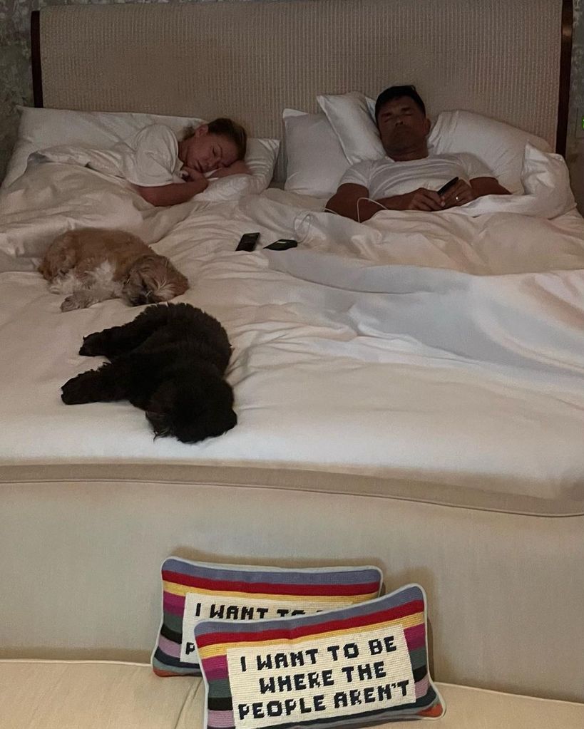 Kelly Ripa and Mark Consuelos in bed with their dogs Lena and Chewie