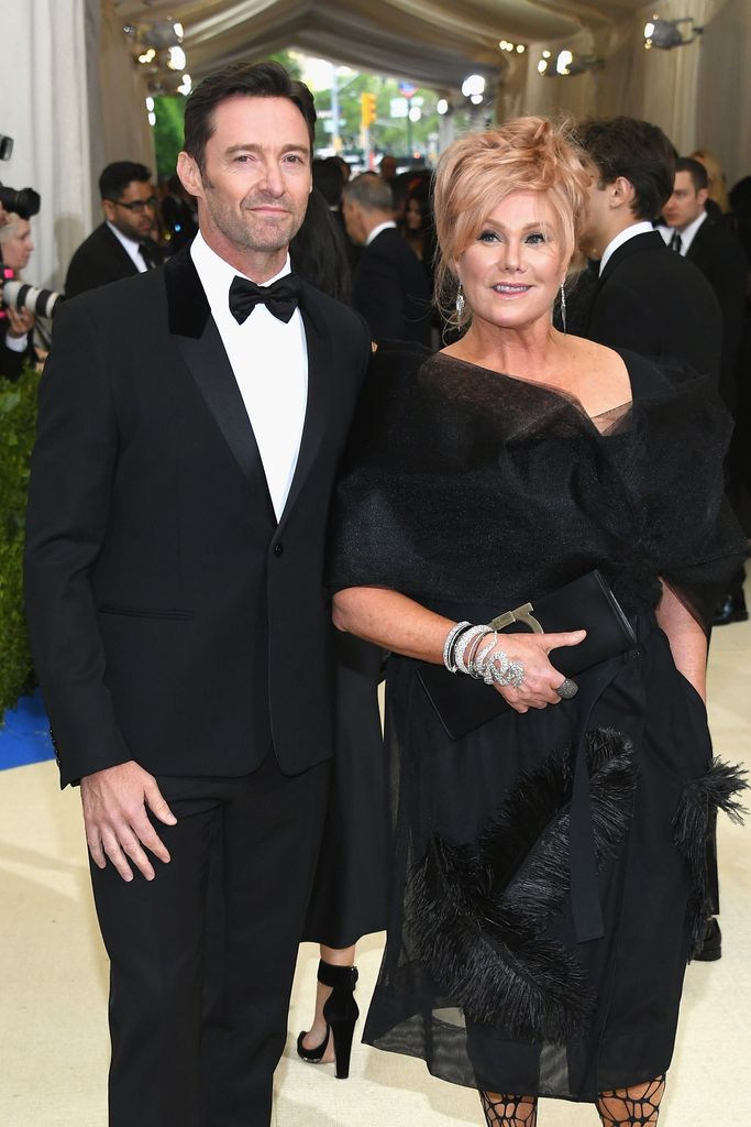 Hugh Jackman in a suit and Deborra-Lee Furness in a tulle dress