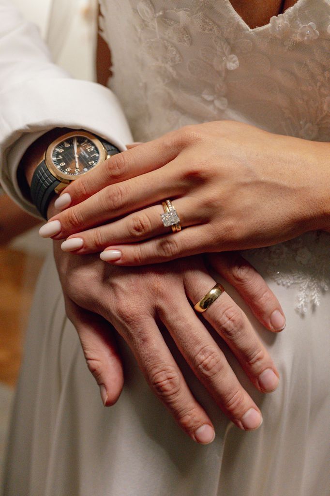 man and woman hand with wedding rings