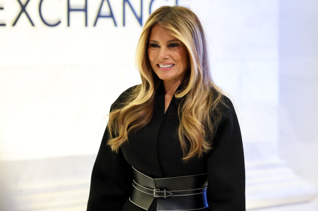 Melania Trump wearing chunky leather belt and black coat