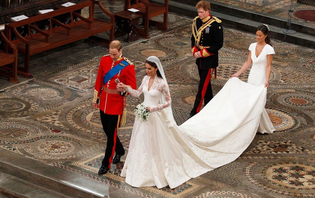 Prince William takes the hand of his bride Catherine Middleton, now to be known as Catherine, Duchess of Cambridge, followed by Prince Harry and Pippa Middleton