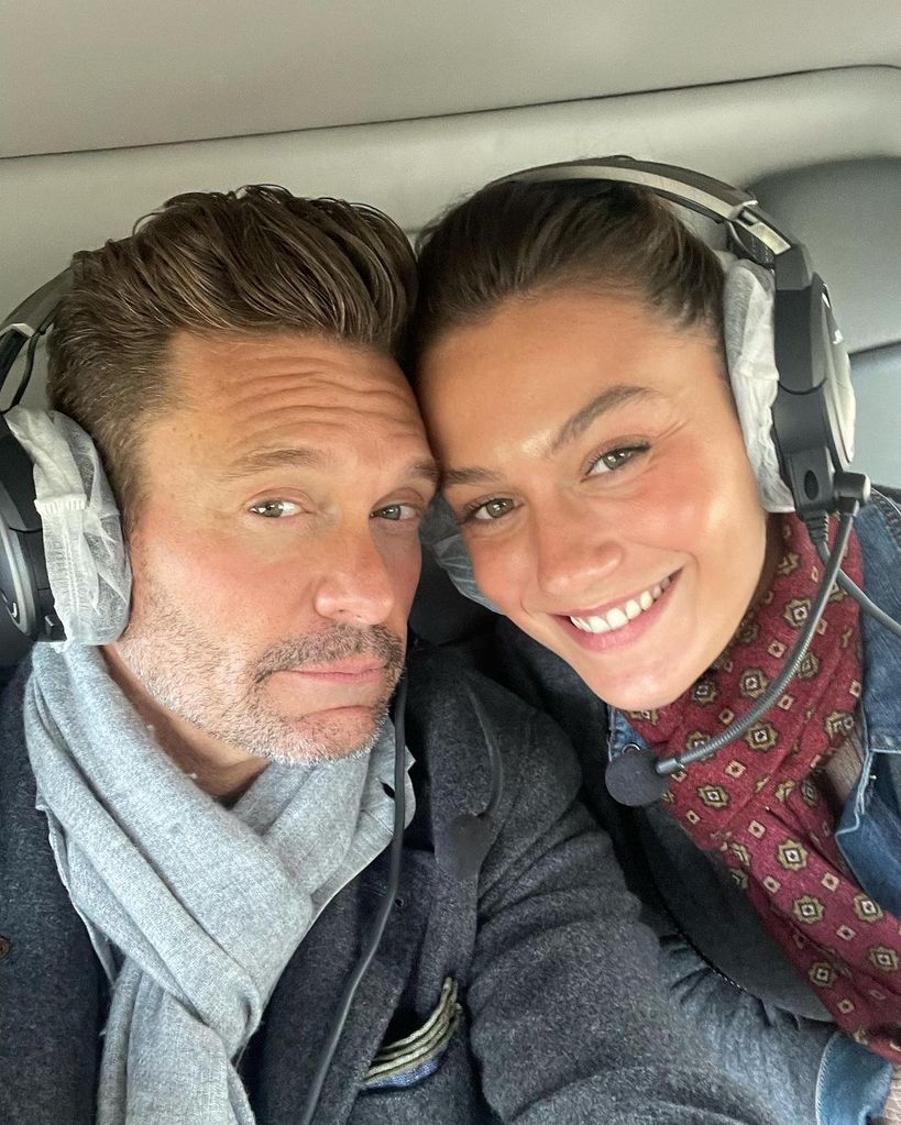 Ryan Seacrest and Aubrey Paige sat in a helicopter