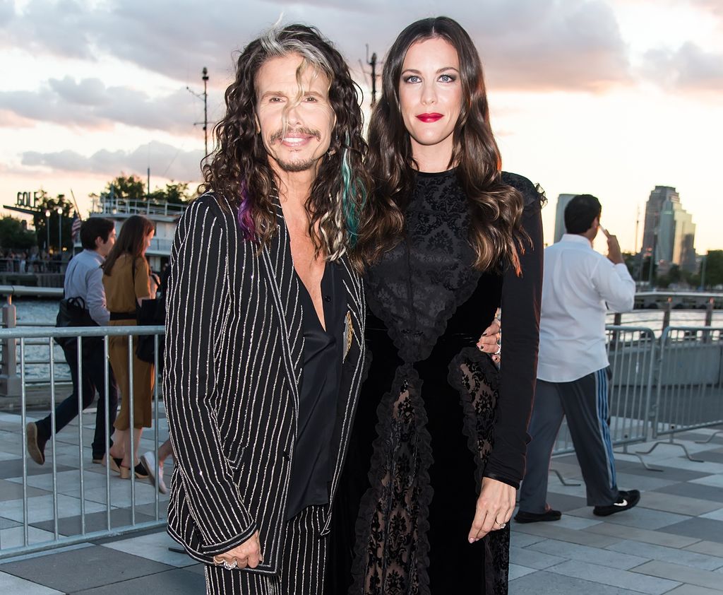 liv tyler posing with steven tyler