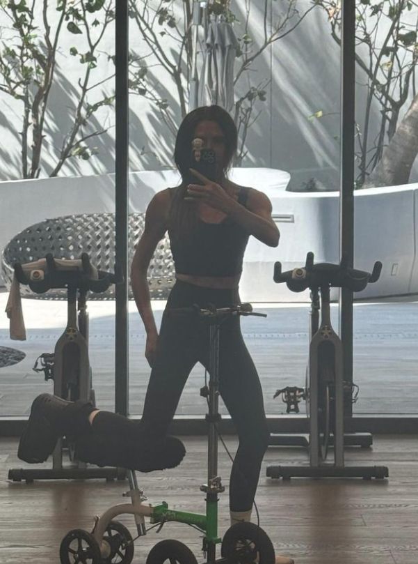Victoria Beckham in workout clothes inside a home gym
