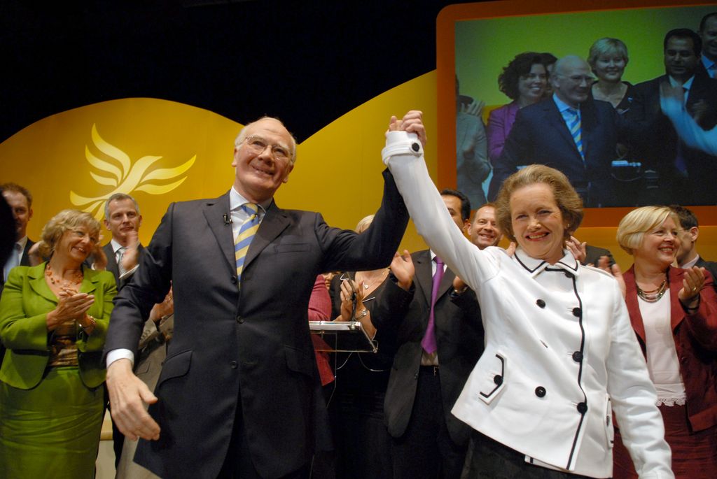Rt. Hon. Sir Menzies Campbell waves with his wife, Lady Elspeth Campbell, to the Liberal Democrats