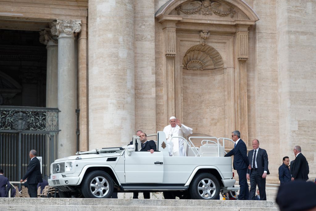 Pope Francis waving from the Popemobile