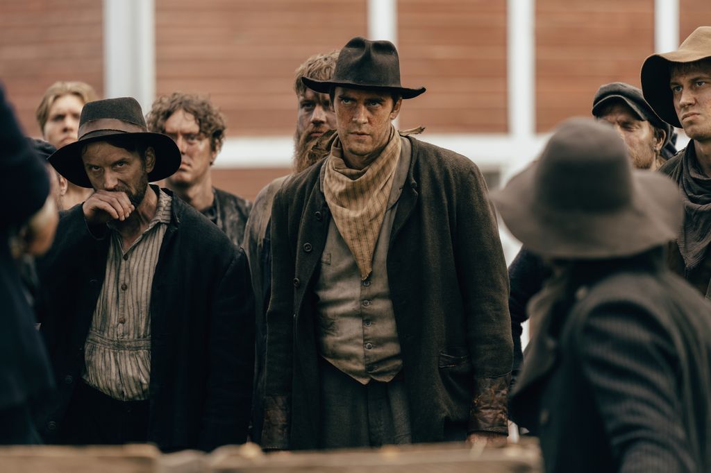 Men in hats stand together