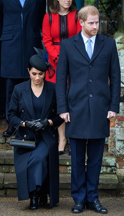 A pregnant meghan markle curtsies to the queen after christmas day church