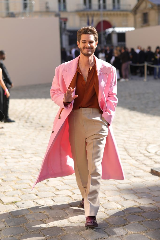 Andrew Garfield attends the Valentino Womenswear Spring/Summer 2024 in pink coat
