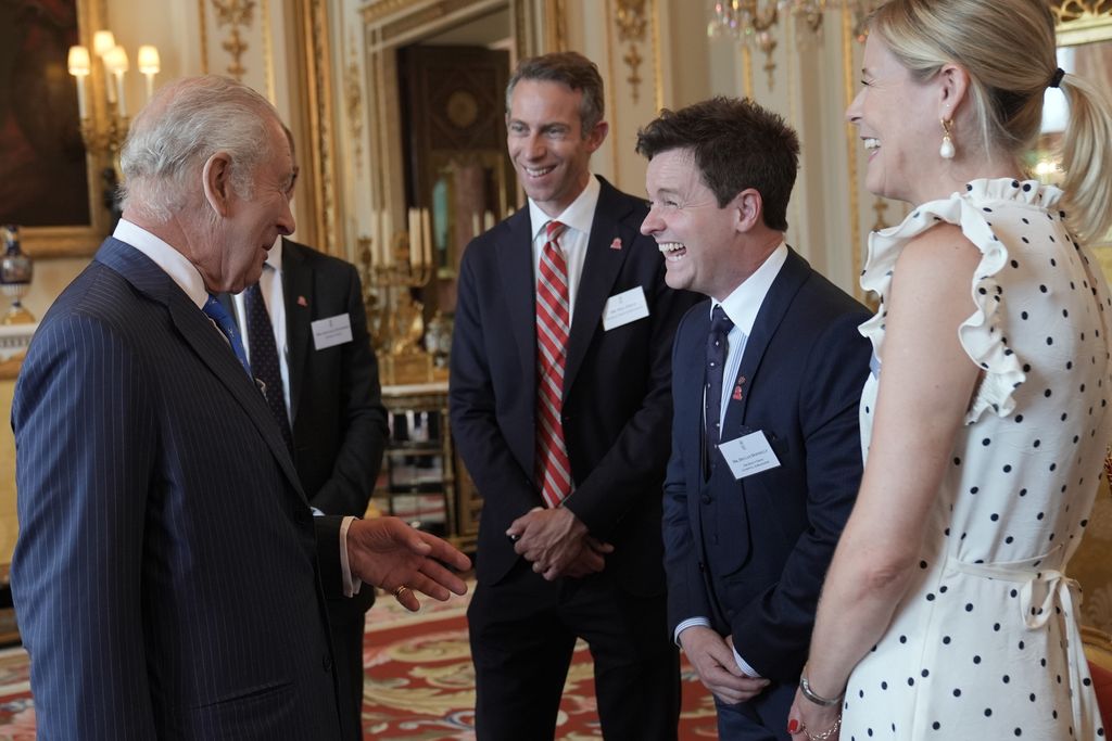 King Charles laughing with Declan Donnelly and his wife Alison