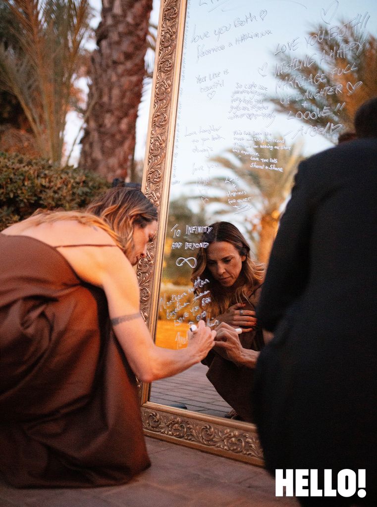 Mel C writing message on mirror at Mel B's Morocco wedding