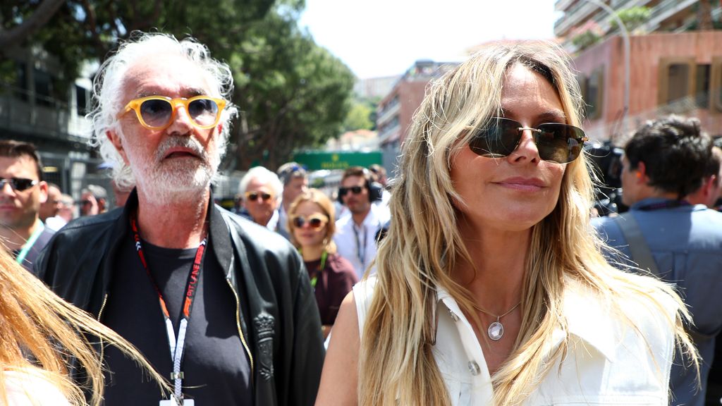 Heidi Klum and Flavio Briatore walk on the grid during the F1 Grand Prix of Monaco
