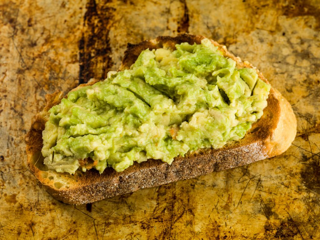 A slice of toast with avacado